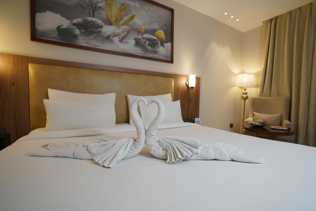 Postel nebo postele na pokoji v ubytování Udman Hotel Gurugram