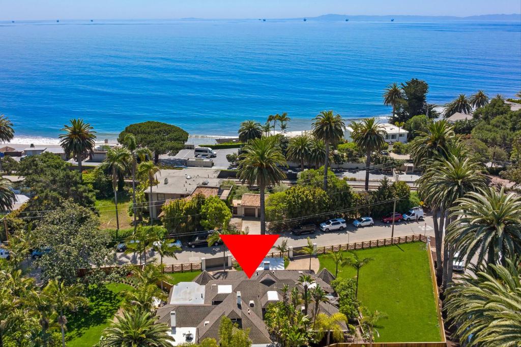 an aerial view of a house with a red triangle at Montecito Hamptons Style Gated Resort - Steps from the Beach in Montecito