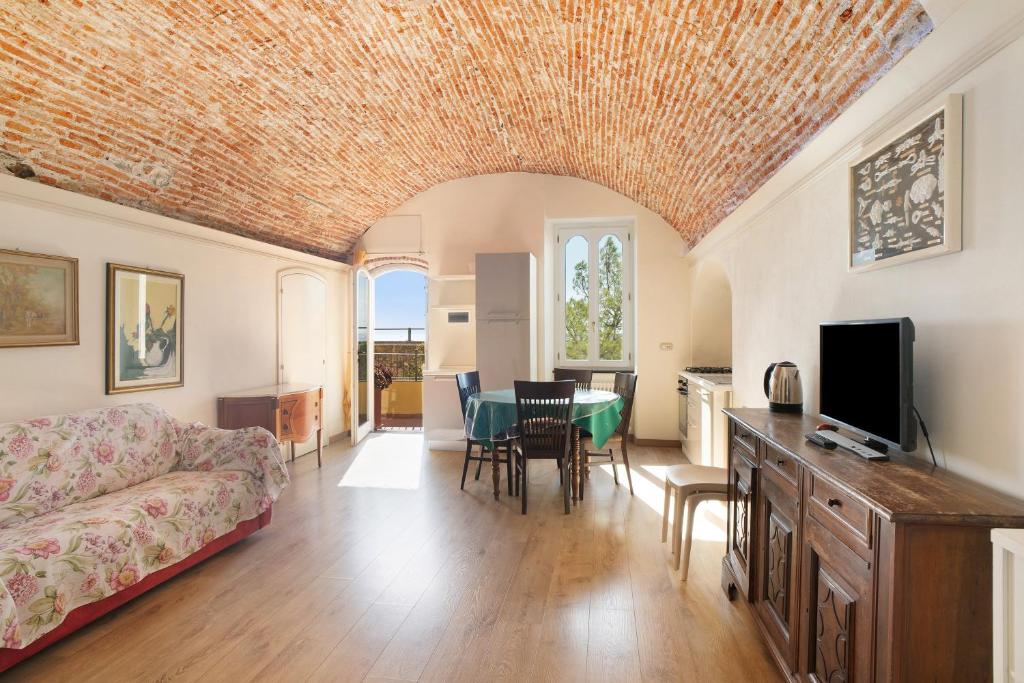 a living room with a couch and a table at Actis1, borgo dei pescatori in Cervo