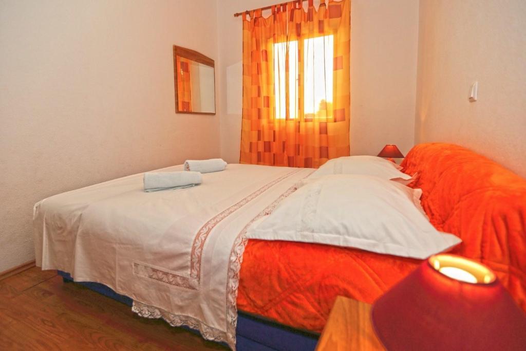 Postel nebo postele na pokoji v ubytování Apartments Boćin Rosso