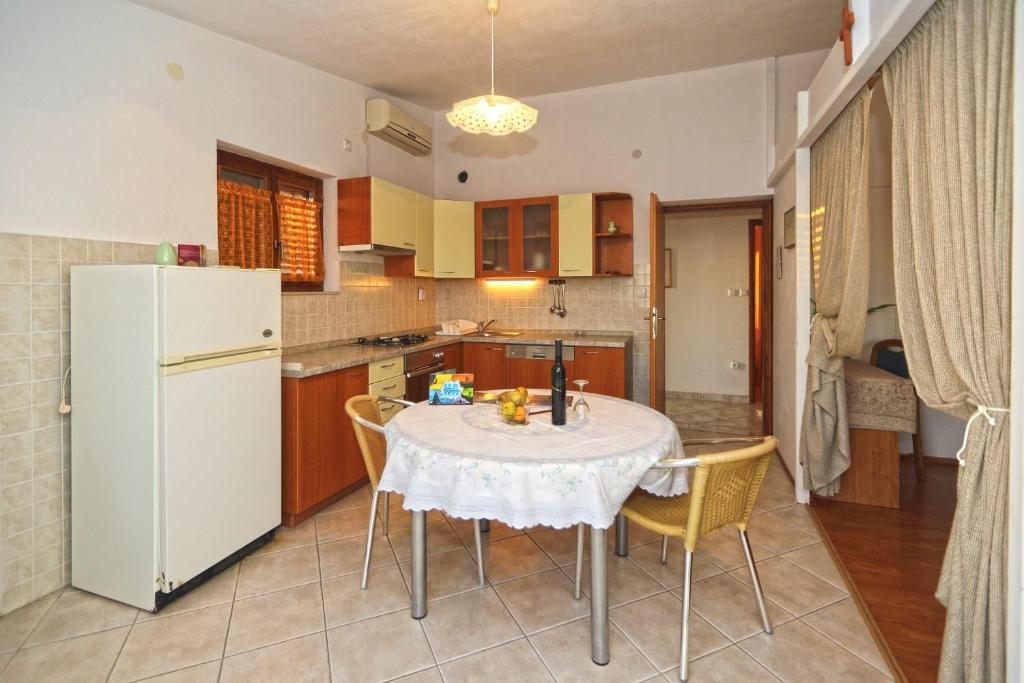 Kuchyň nebo kuchyňský kout v ubytování Apartments Boćin Rosso