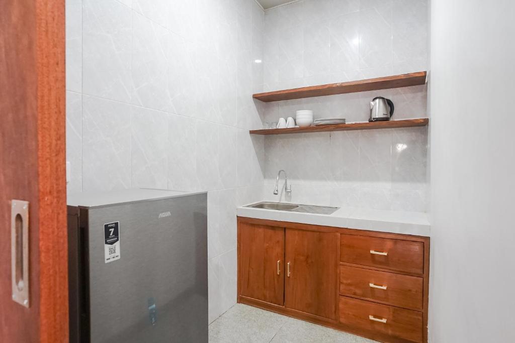 Kuchyň nebo kuchyňský kout v ubytování Maisaba Coliving Cempaka