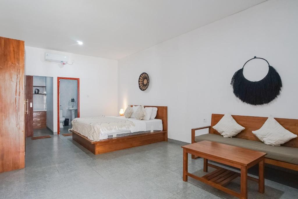 Postel nebo postele na pokoji v ubytování Maisaba Coliving Cempaka