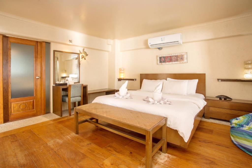 Postel nebo postele na pokoji v ubytování Mayumi Beach Villa