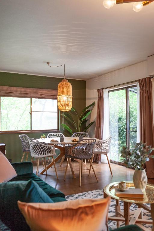a living room with a table and chairs at S-villa Nasu 6th in Anazawa