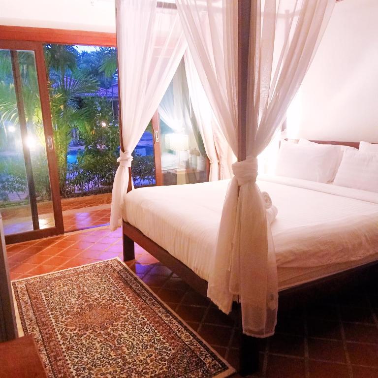 Postel nebo postele na pokoji v ubytování Siam Tara Resort Chiangkhong