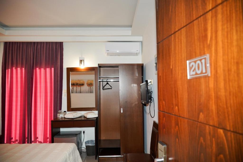 Postel nebo postele na pokoji v ubytování Hotel Selini