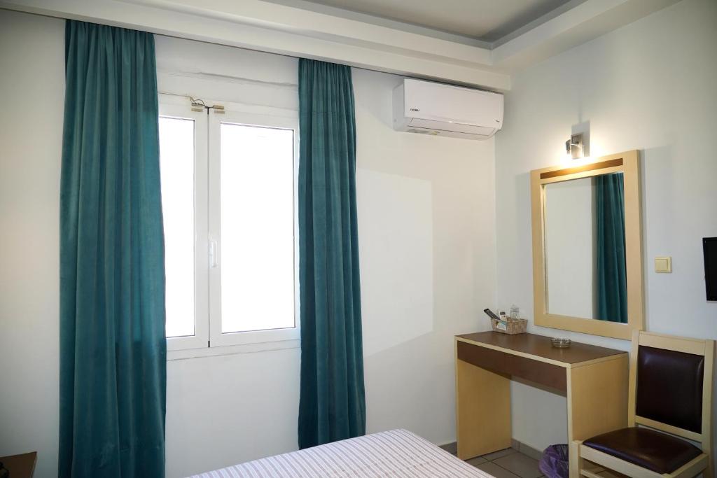 Postel nebo postele na pokoji v ubytování Hotel Selini