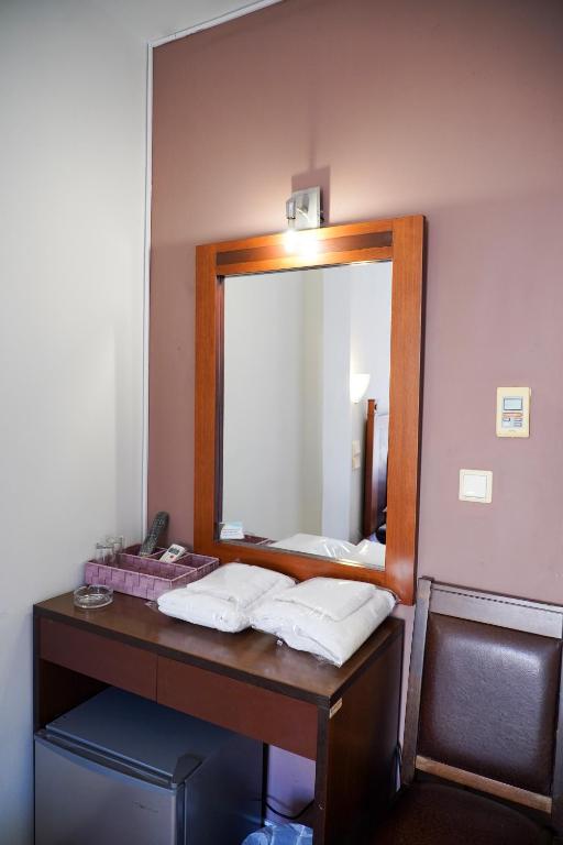 Postel nebo postele na pokoji v ubytování Hotel Selini