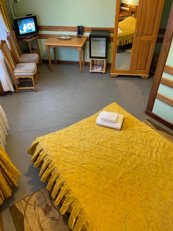 Postel nebo postele na pokoji v ubytování Tisa Hotel