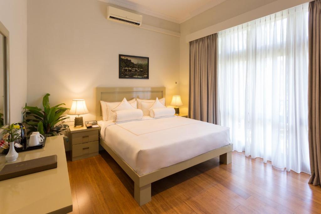 Postel nebo postele na pokoji v ubytování Serene Villa 38