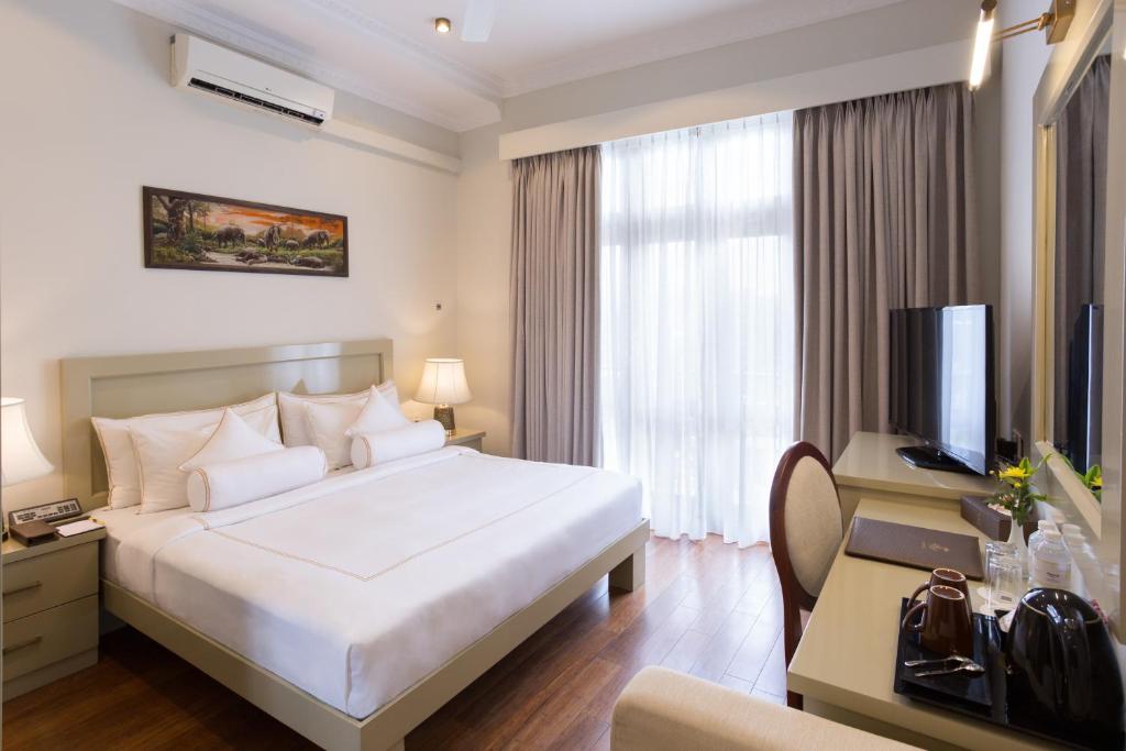 Postel nebo postele na pokoji v ubytování Serene Villa 38