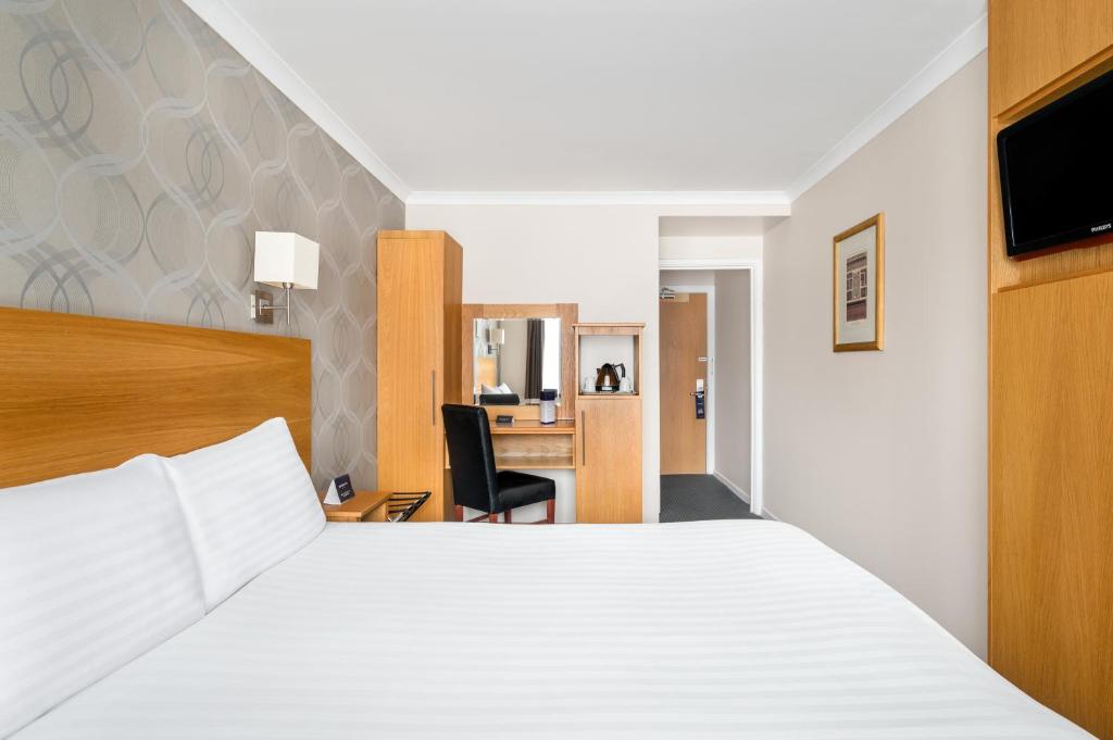 Postel nebo postele na pokoji v ubytování Rooms Inn