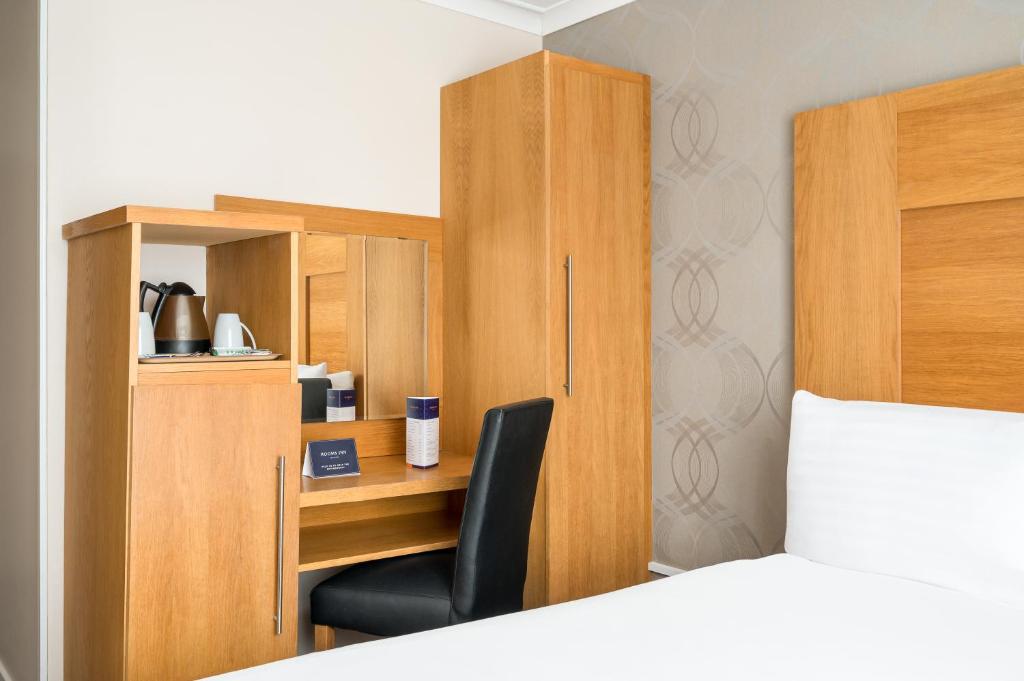 Postel nebo postele na pokoji v ubytování Rooms Inn