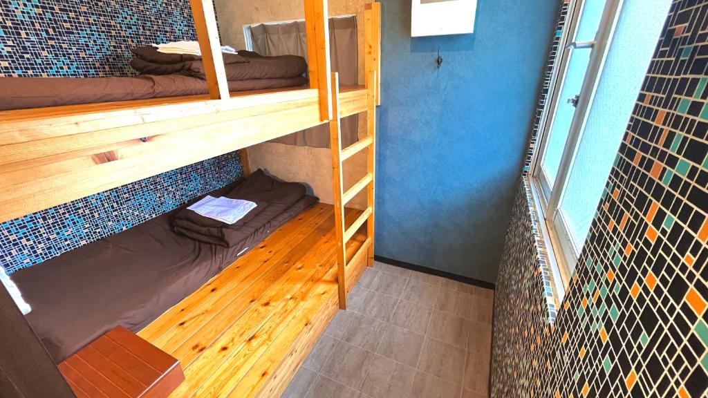 Postel nebo postele na pokoji v ubytování R Hostel Namba south