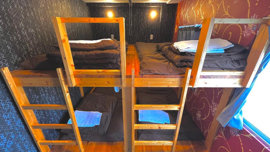 Postel nebo postele na pokoji v ubytování R Hostel Namba south
