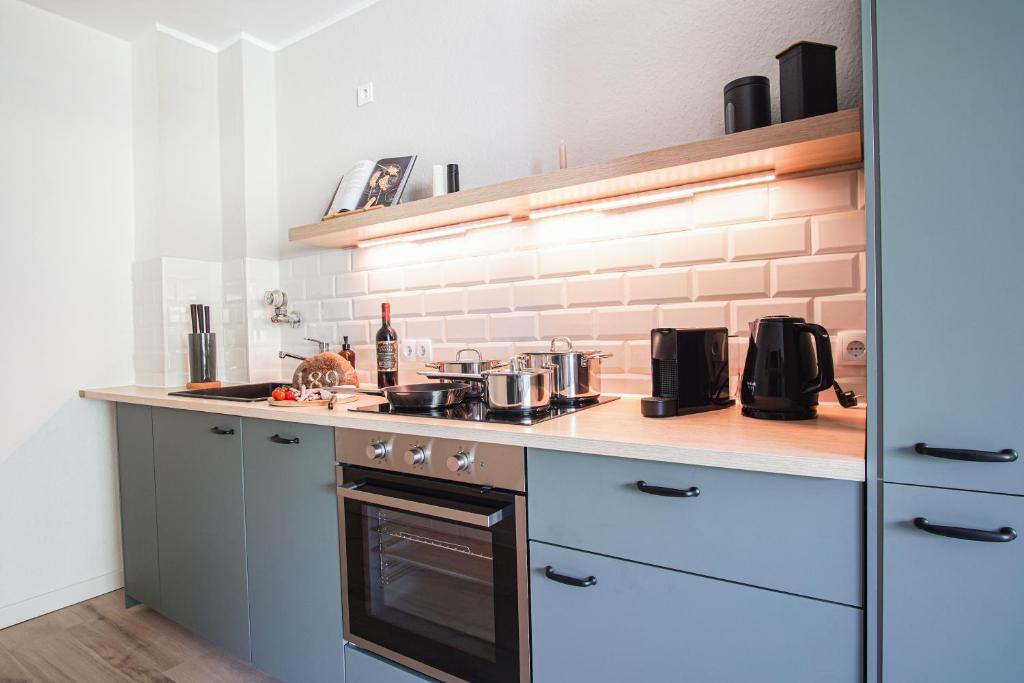 Homefy Wohlfühl-Apartment, mit Parkplatz, Balkon und Garten tesisinde mutfak veya mini mutfak