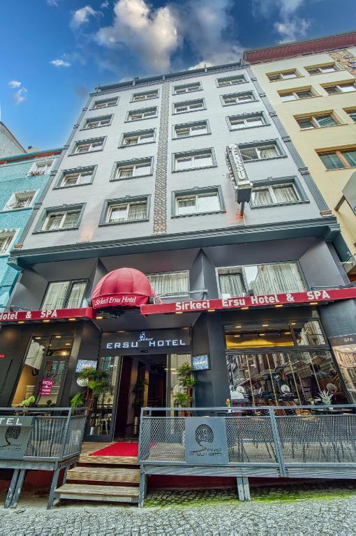 a large building with a restaurant in front of it at Sirkeci Ersu Hotel & SPA in Istanbul