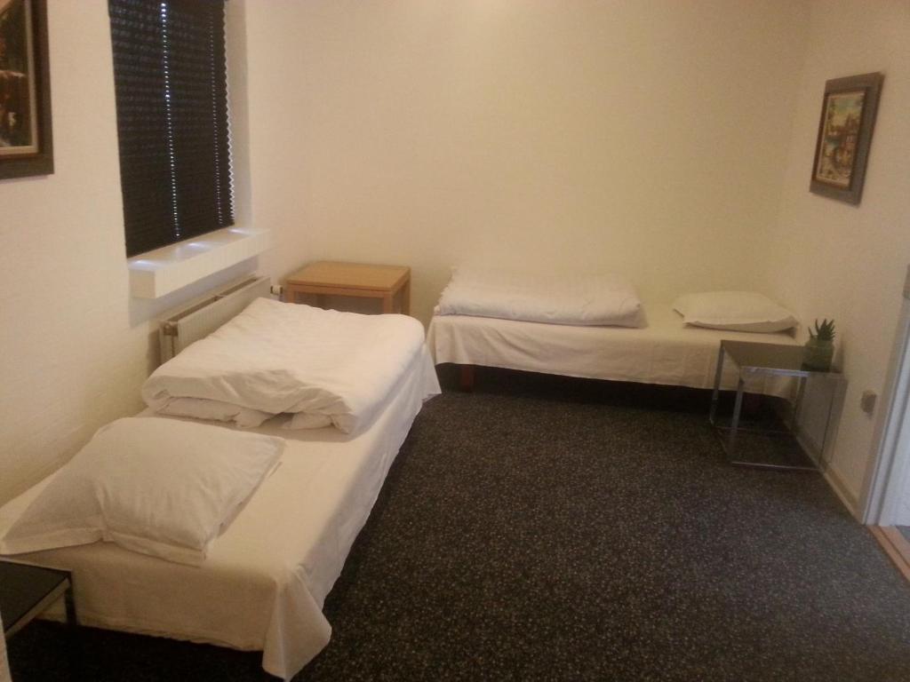 Postel nebo postele na pokoji v ubytování Centrum Sleepover