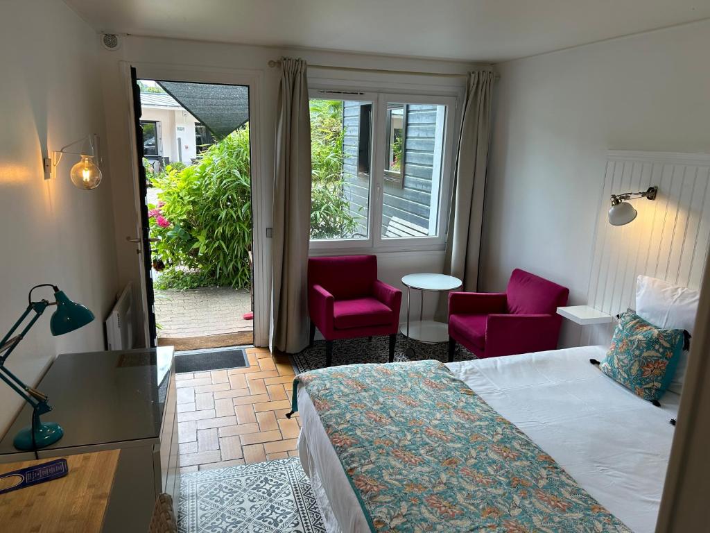 Postel nebo postele na pokoji v ubytování Hôtel Monet