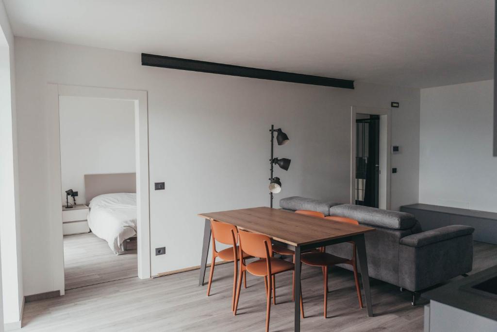 a living room with a table and a couch at La Finestra sulla Valle in Castel Ivano
