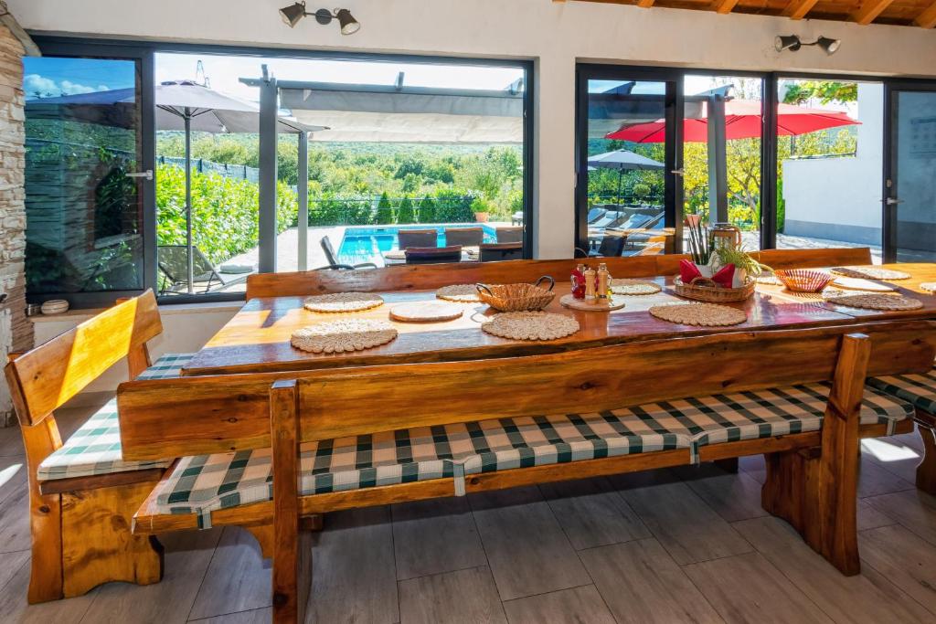 a large wooden table with food on top of it at Peaceful Dream in Ercegovci