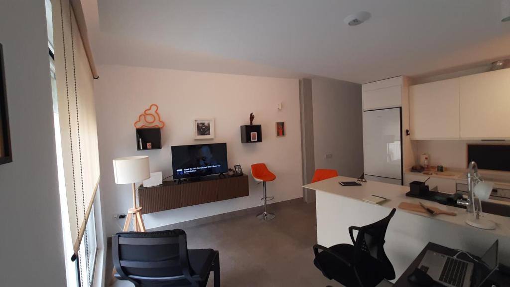 Televízia a/alebo spoločenská miestnosť v ubytovaní Apartment with two Suites in the Center of Malaga