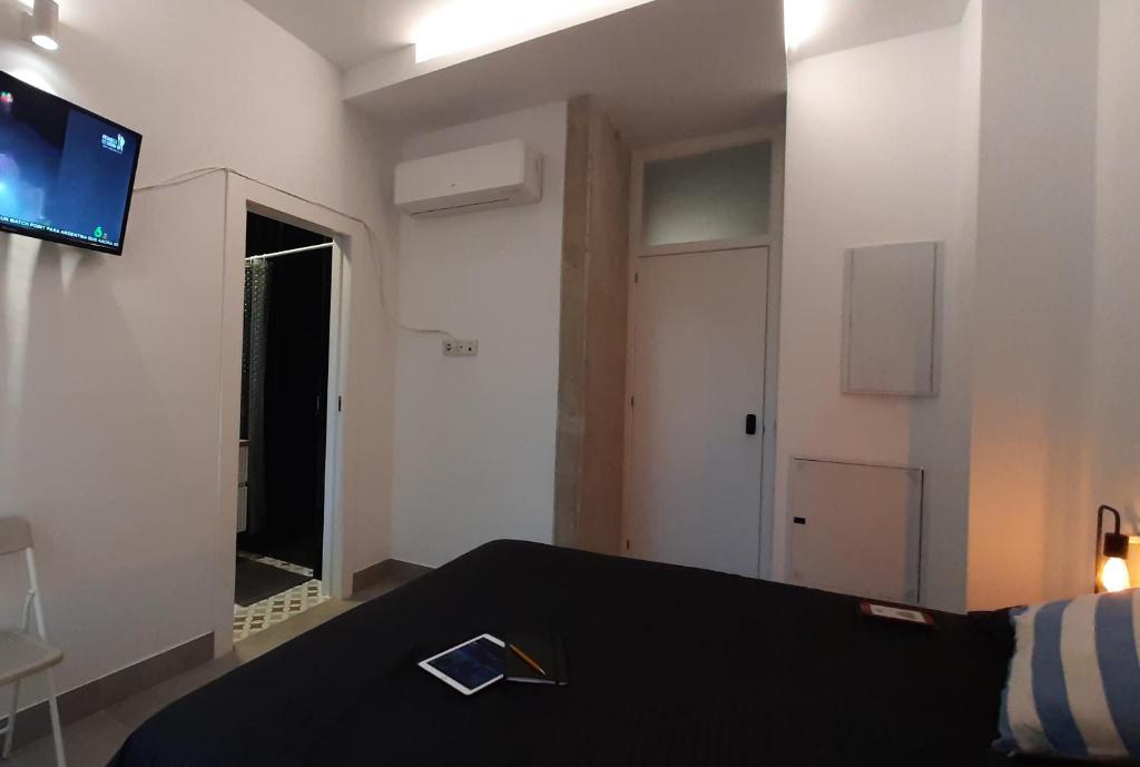 Televízia a/alebo spoločenská miestnosť v ubytovaní Apartment with two Suites in the Center of Malaga