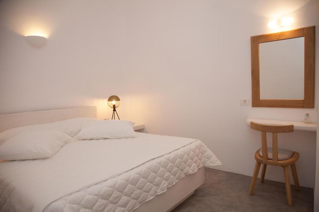 Łóżko lub łóżka w pokoju w obiekcie Fanari Vista Suites
