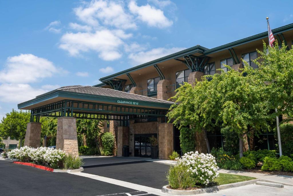 a building with a parking lot in front of it at Hampton Inn & Suites Agoura Hills in Agoura Hills