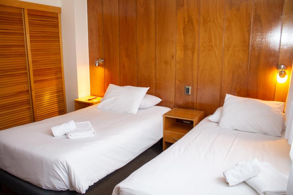 Postel nebo postele na pokoji v ubytování Hotel Germania