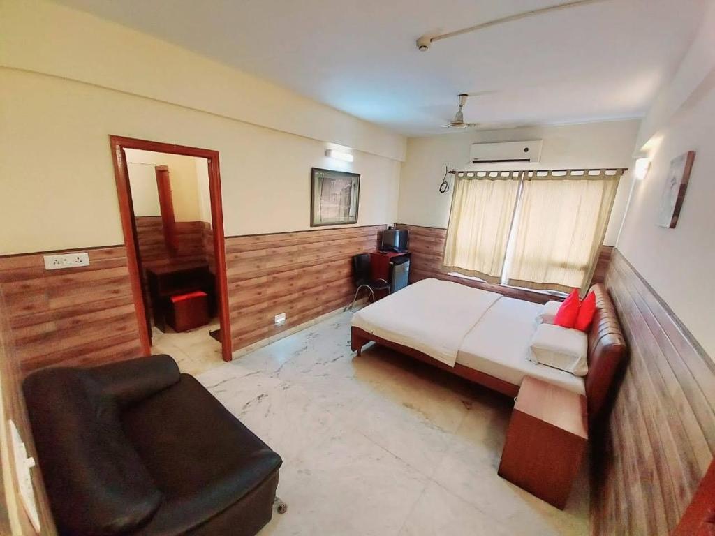 Postel nebo postele na pokoji v ubytování Malik Guest House