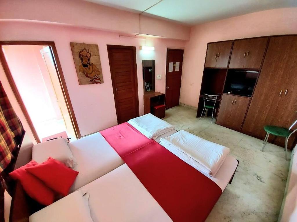 Postel nebo postele na pokoji v ubytování Malik Guest House