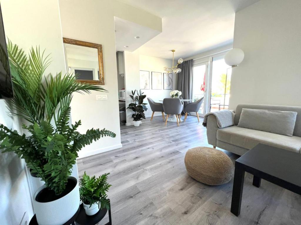 a living room with a couch and some plants at Grandes Playas Haven in Corralejo