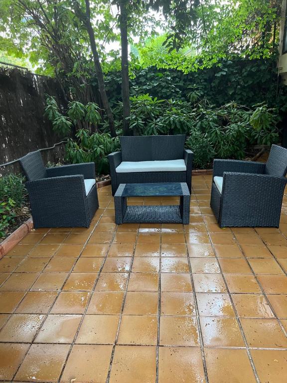 two chairs and a table on a patio at The Garden Madrid in Madrid