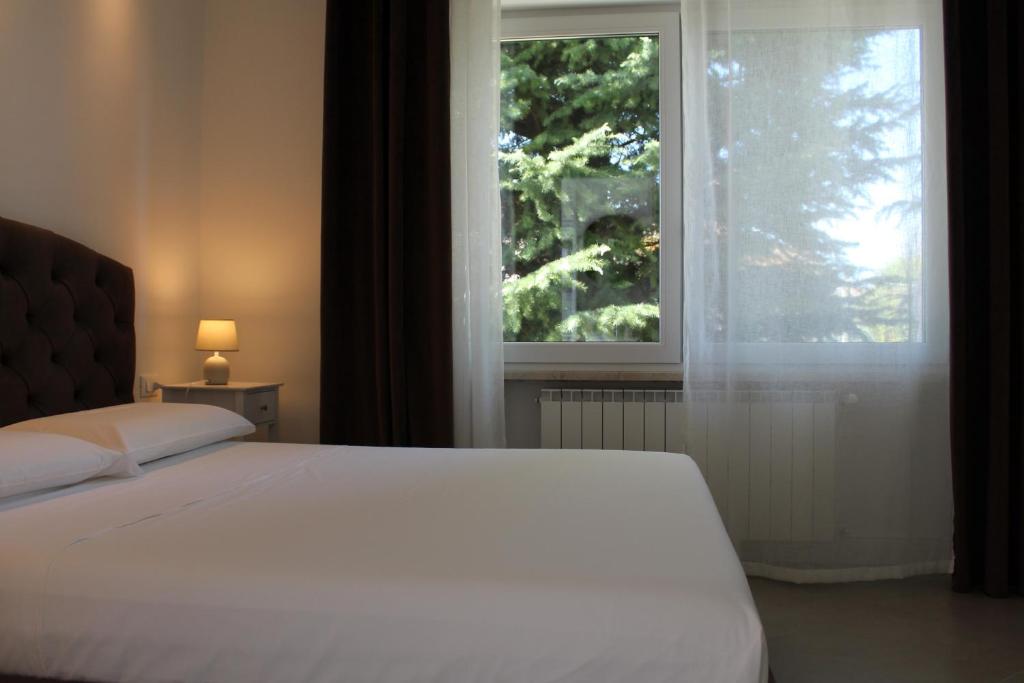 Postel nebo postele na pokoji v ubytování Villa Forte Salvi - Rooms