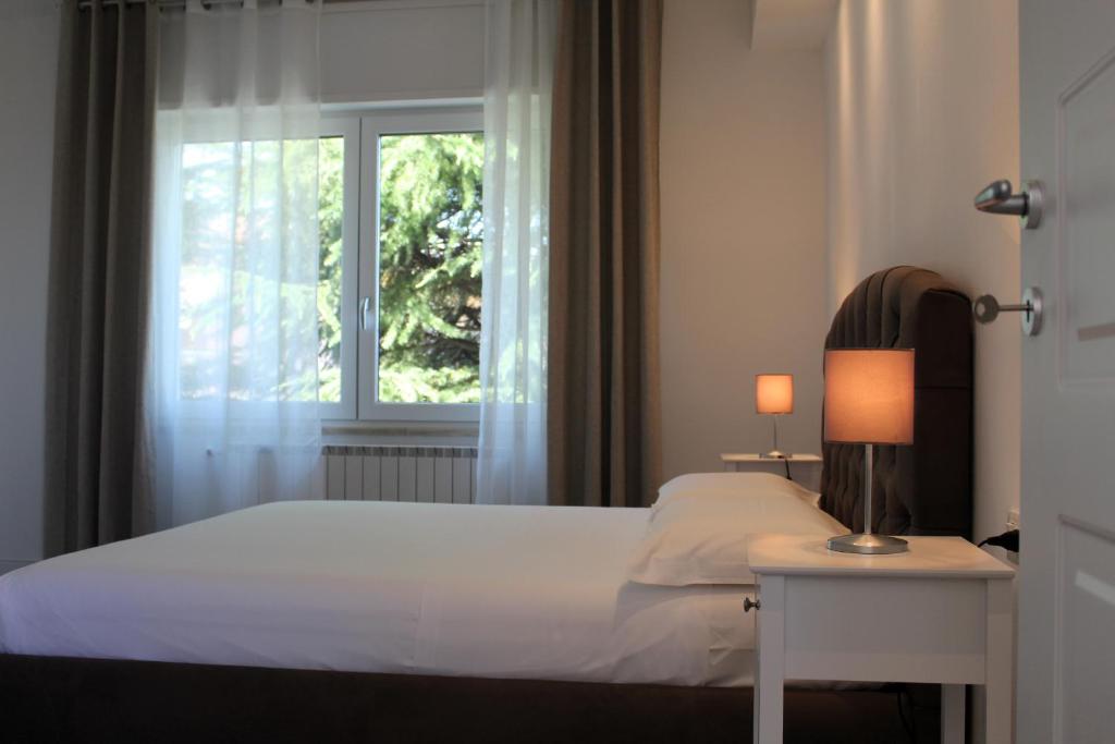 Postel nebo postele na pokoji v ubytování Villa Forte Salvi - Rooms