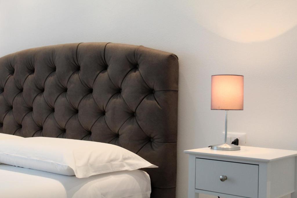 Postel nebo postele na pokoji v ubytování Villa Forte Salvi - Rooms