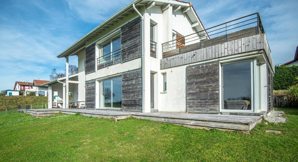 a house with a large window on the side of it at VILLA ARCANGUES in Arcangues