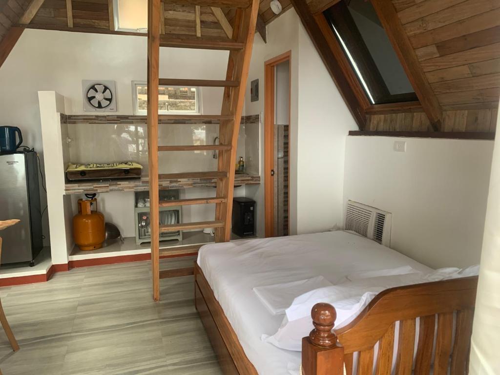 a bedroom with a bunk bed with a ladder at A-House Beachfront 