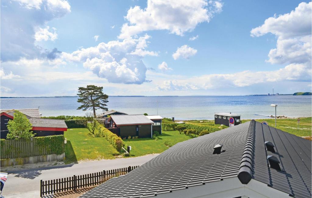 a view of the ocean from the roof of a house at Beautiful Home In Rnde With 3 Bedrooms And Wifi in Rønde