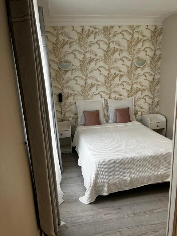 Postel nebo postele na pokoji v ubytování Hôtel Marie Louise
