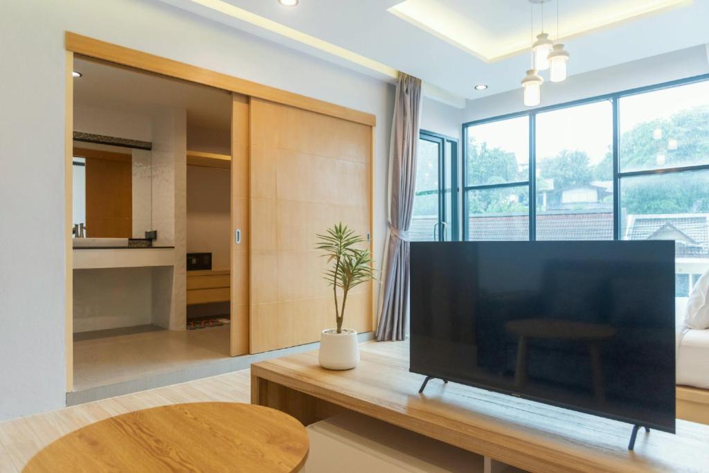 TV a/nebo společenská místnost v ubytování OneLoft Hotel