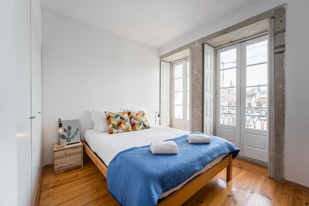 Säng eller sängar i ett rum på Panorama Apartments Porto Clerigos