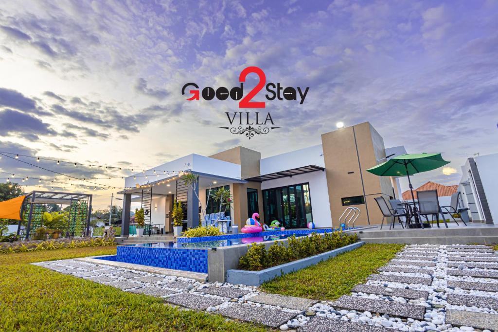 a villa with a swimming pool in a resort at Good2Stay Villa in Melaka