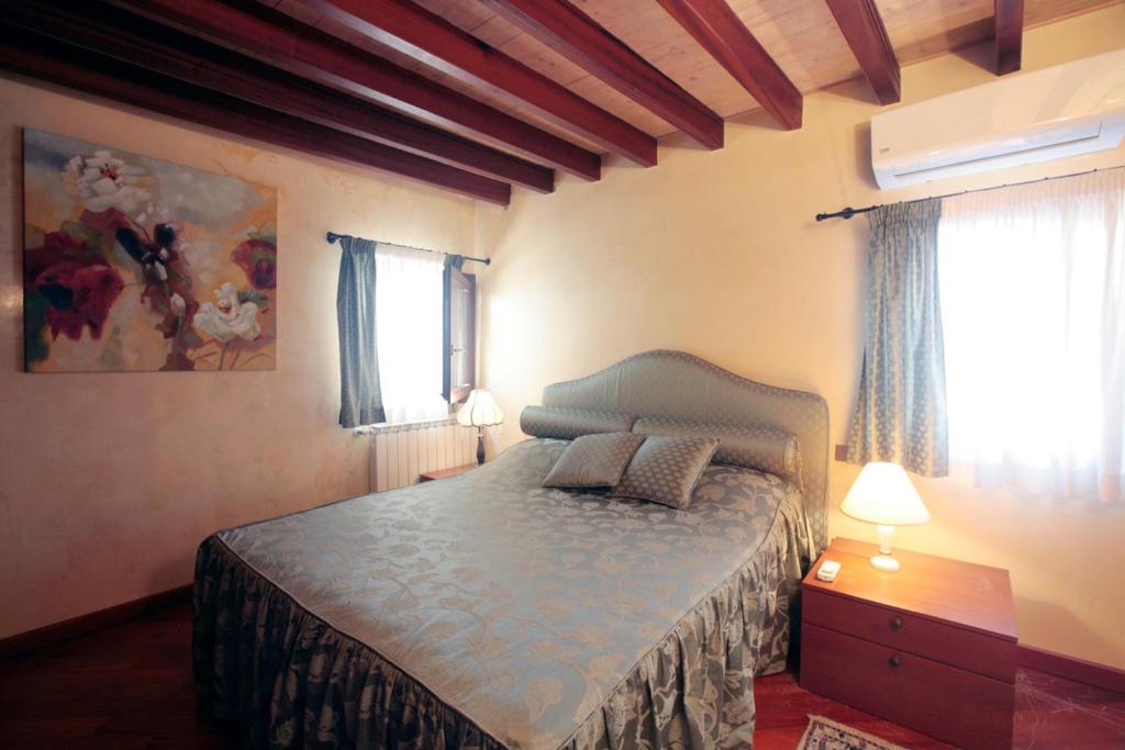 Säng eller sängar i ett rum på San Marco Apartments