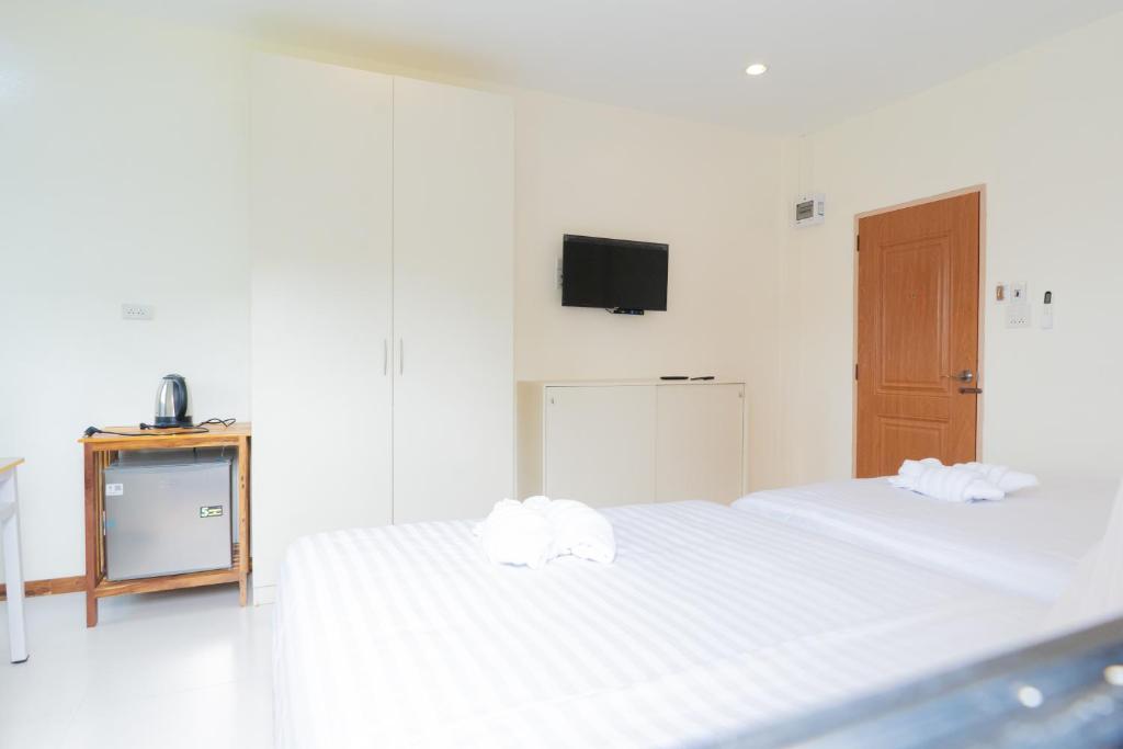 Postel nebo postele na pokoji v ubytování Chotika Hotel โรงแรมโชติกา ณ เชียงคาน