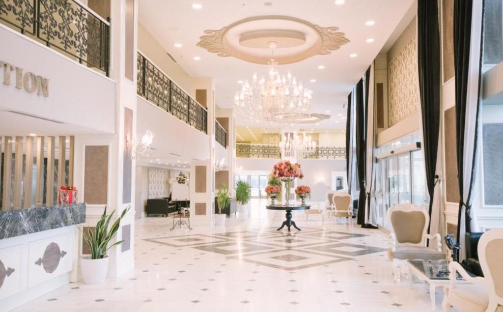 a lobby of a store with a chandelier at Burgaz İzer Hotel in Lüleburgaz