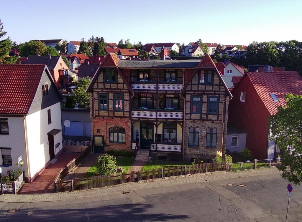 a large brick house in a city with buildings at FeWo in Ilsenburg Waldblick, schöne Aussicht in Ilsenburg