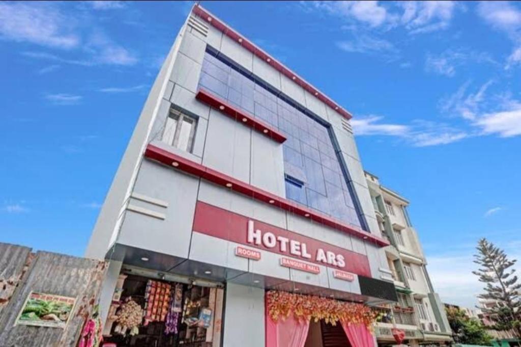 a building with a hotel arc sign on it at Hotel A R S in Patna